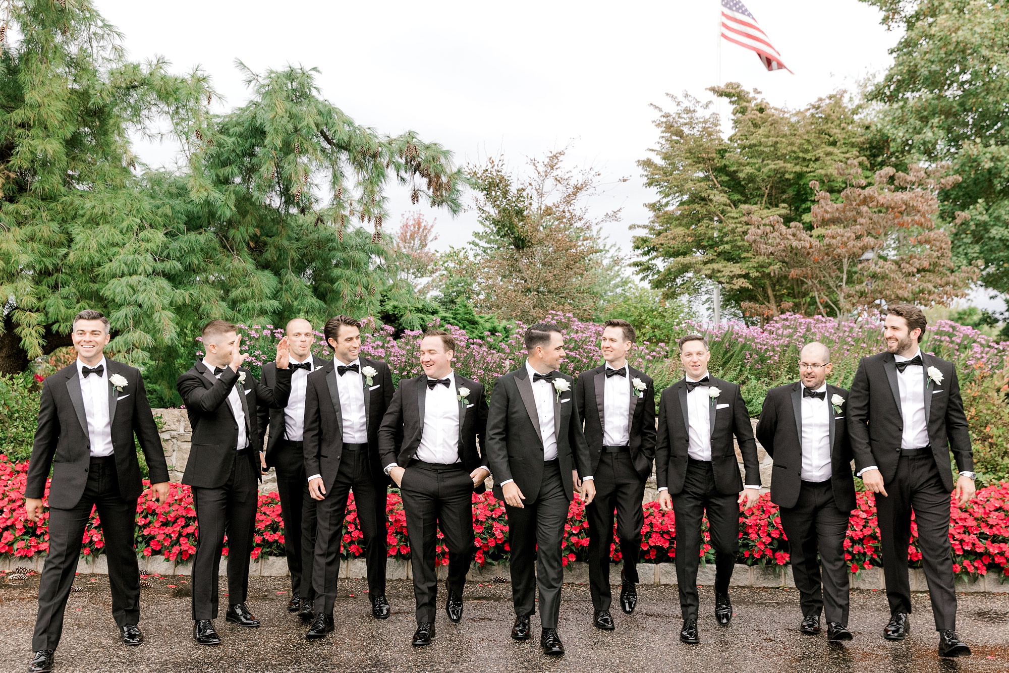 groom walks with groomsmen outside Fiddler’s Elbow Country Club 