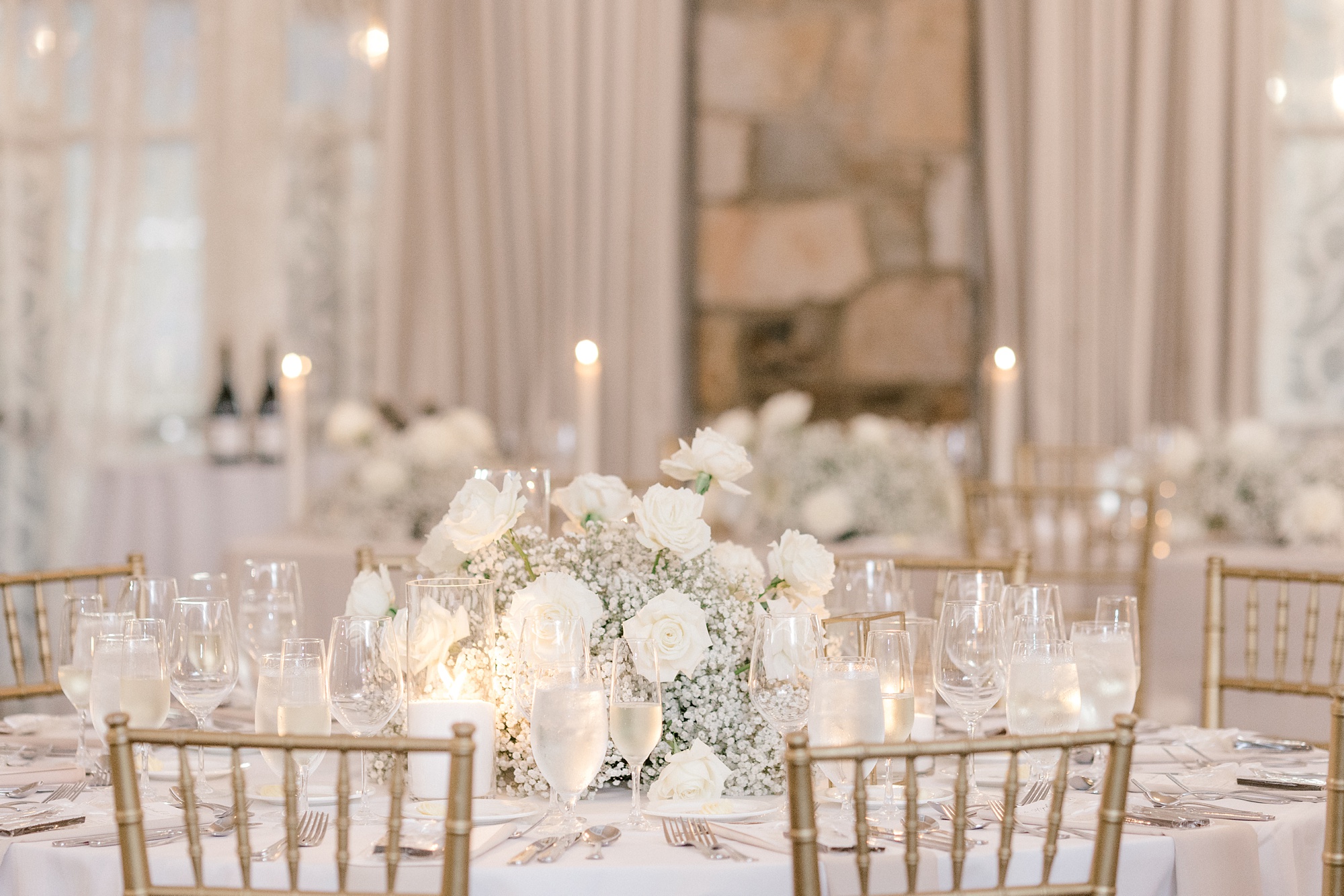 fall wedding reception at Fiddler's Elbow Country Club with baby's breath and white rose centerpieces