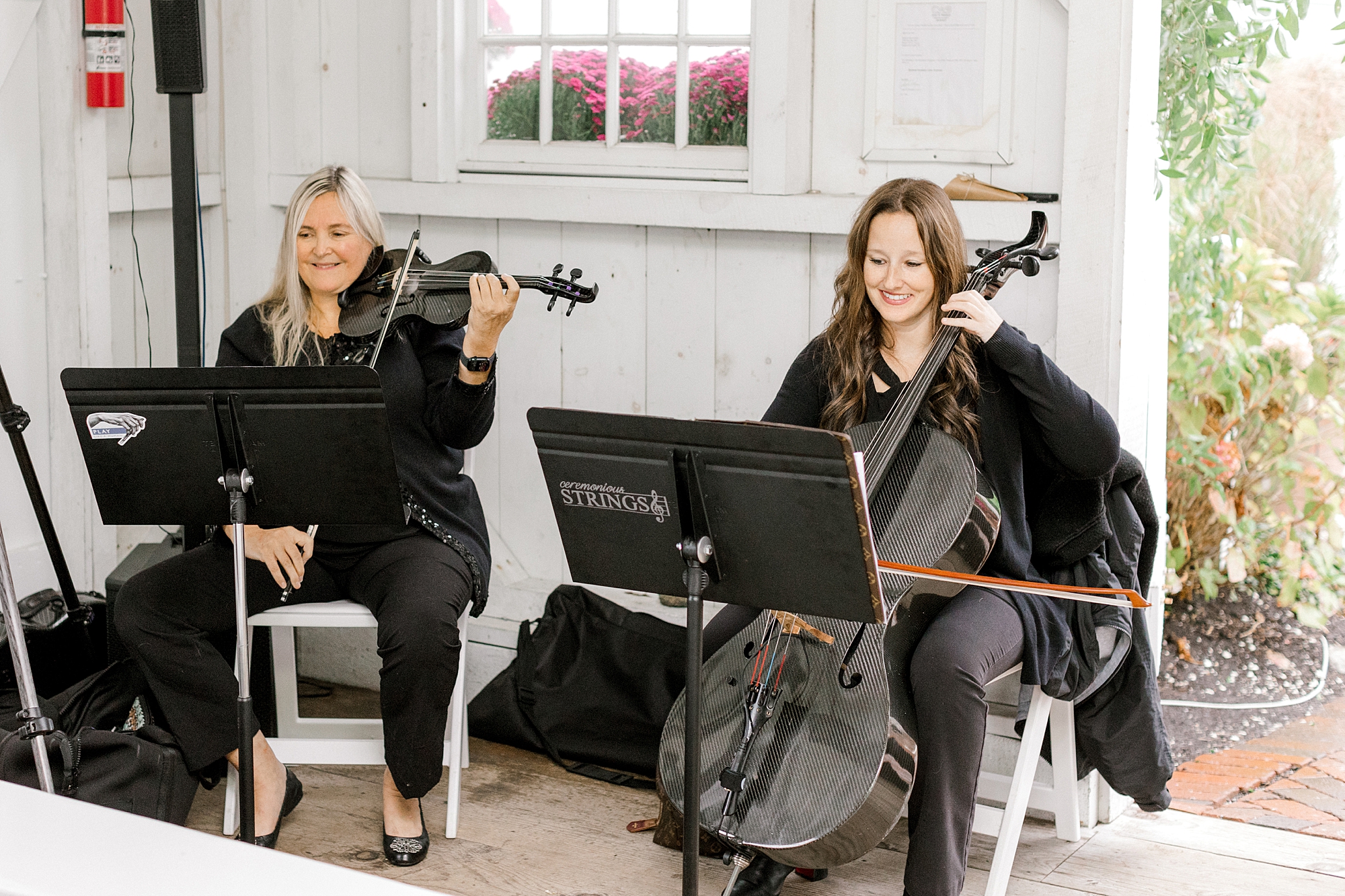 string duo plays during wedding ceremony at Bonnet Island Estate