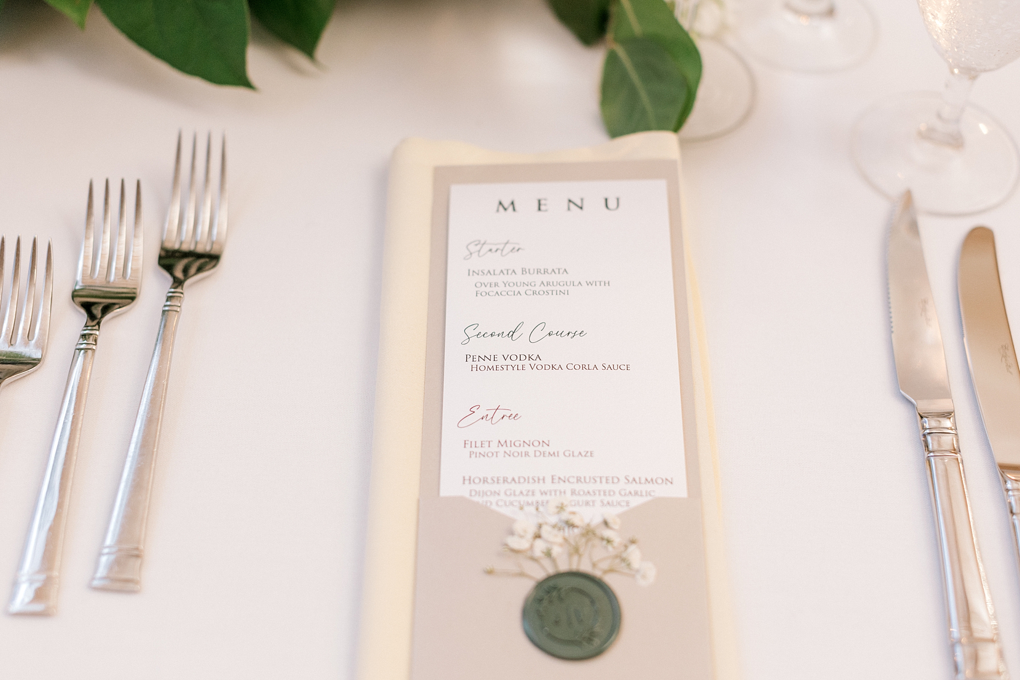menu card with green wax seal on ivory napkin at Bonnet Island Estate