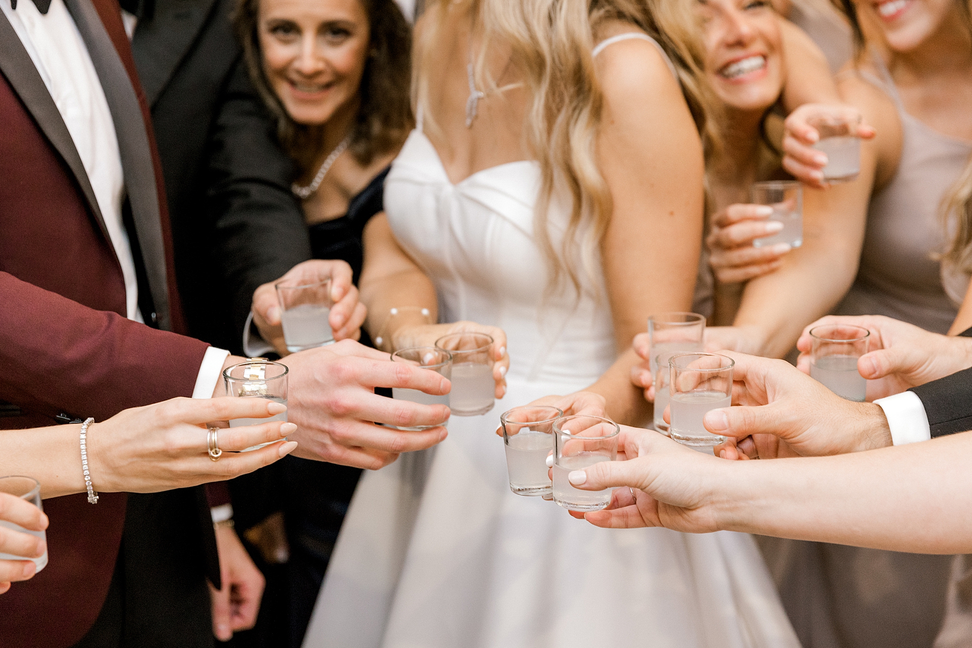 bride toasts shots with wedding party before Long Beach Island wedding reception