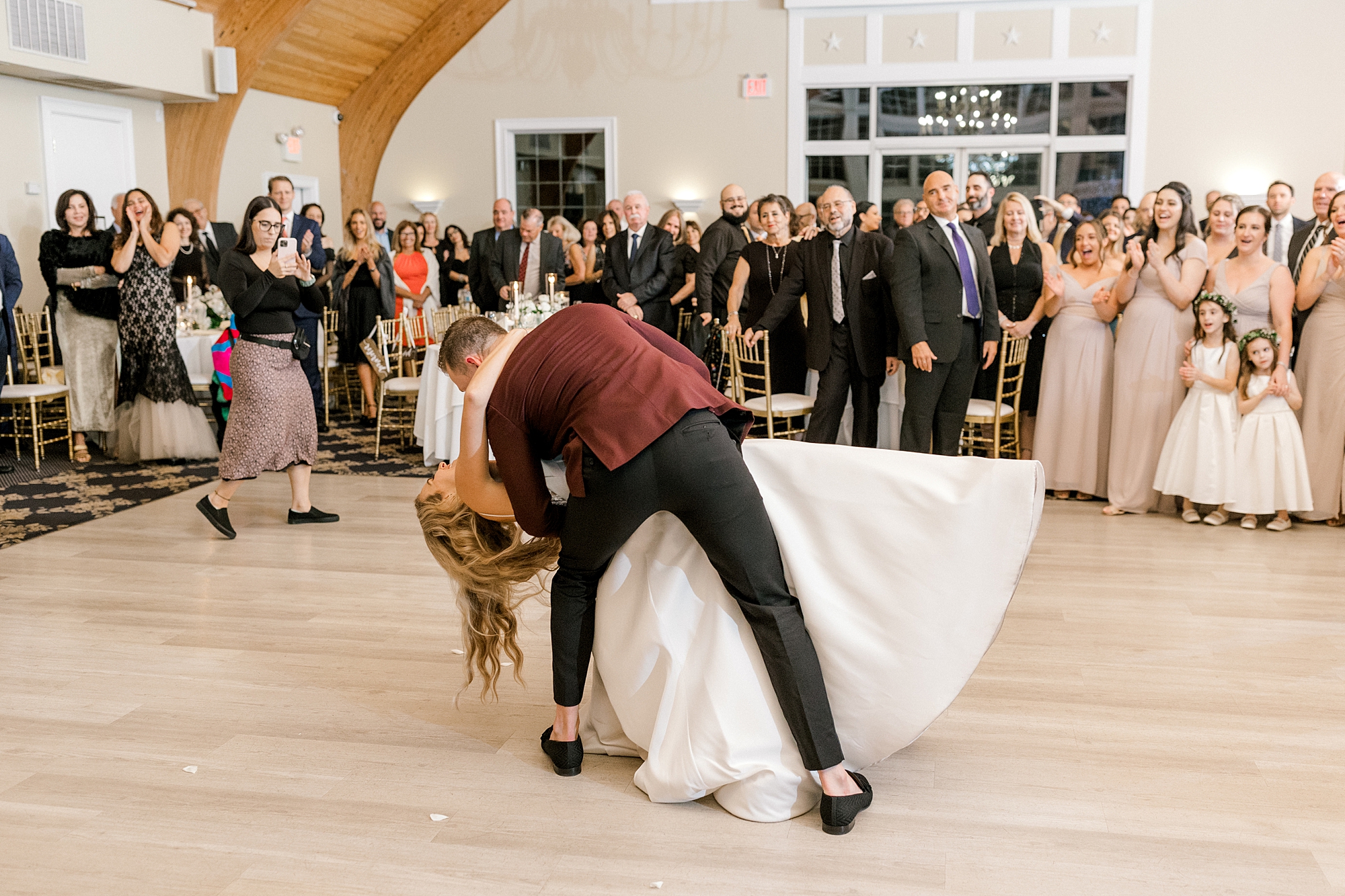 groom dips bride during Long Beach Island wedding reception