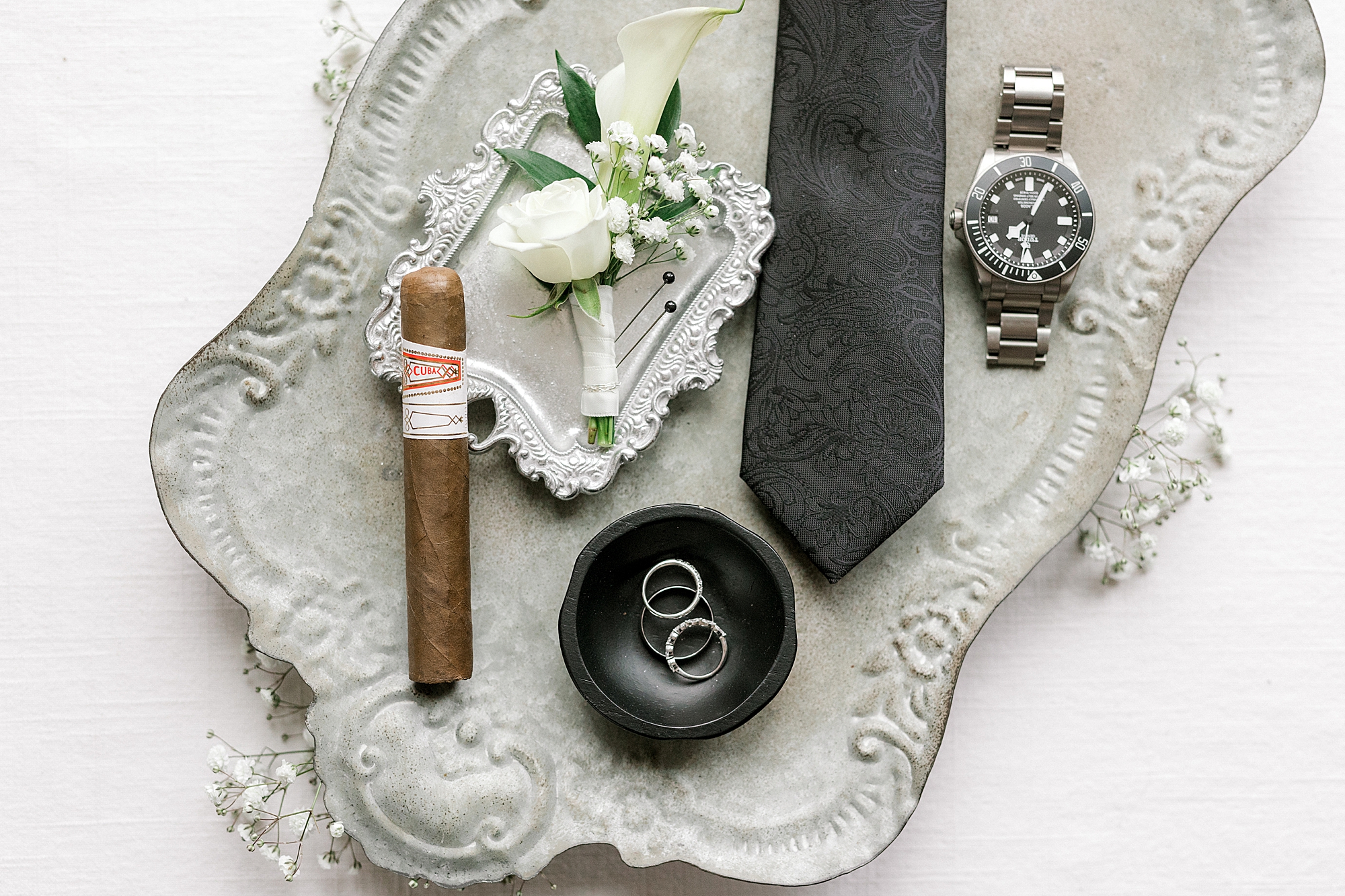 groom's details lays on silver tray before Bonnet Island Estate wedding