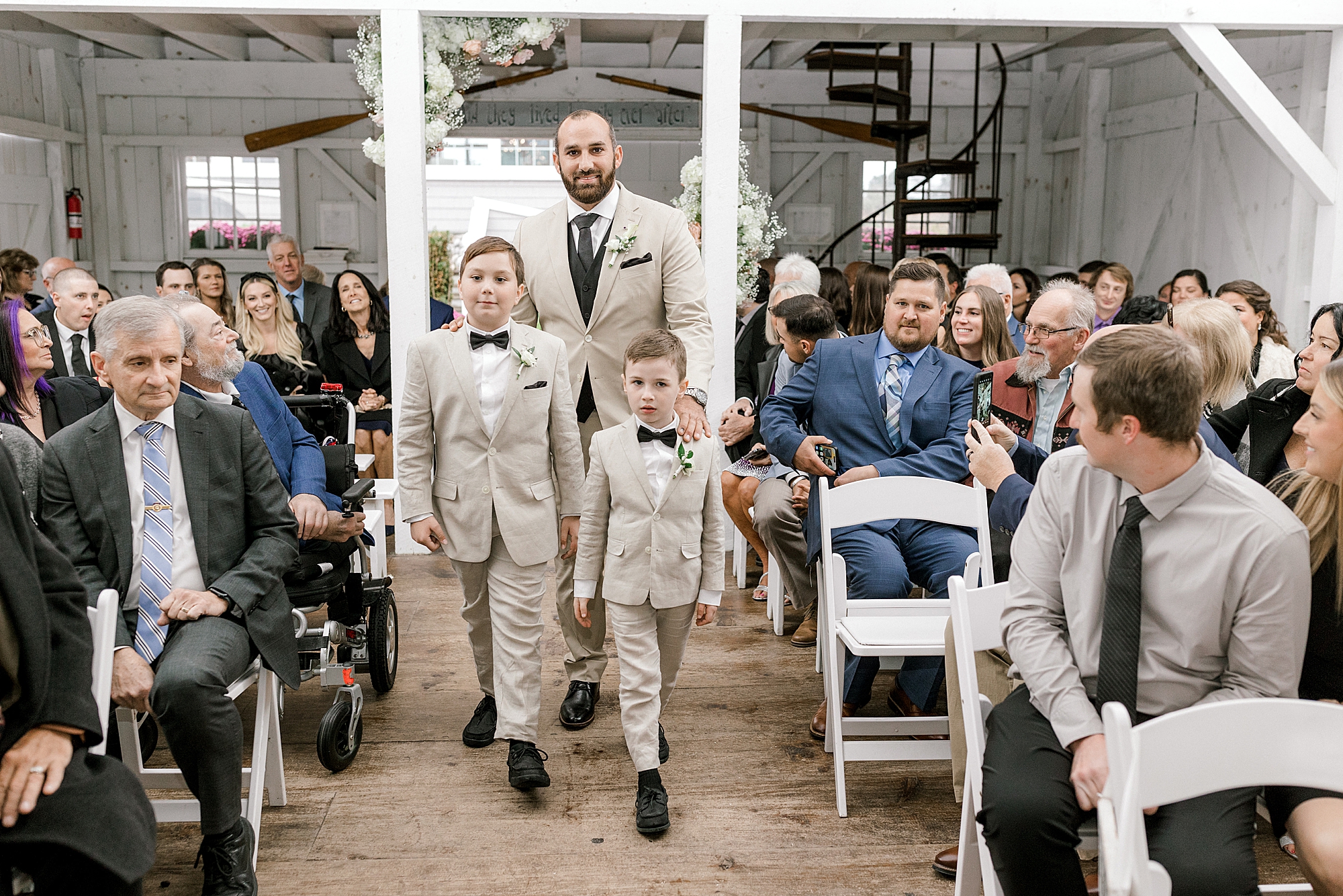groom walks down aisle with sons at Bonnet Island Estate