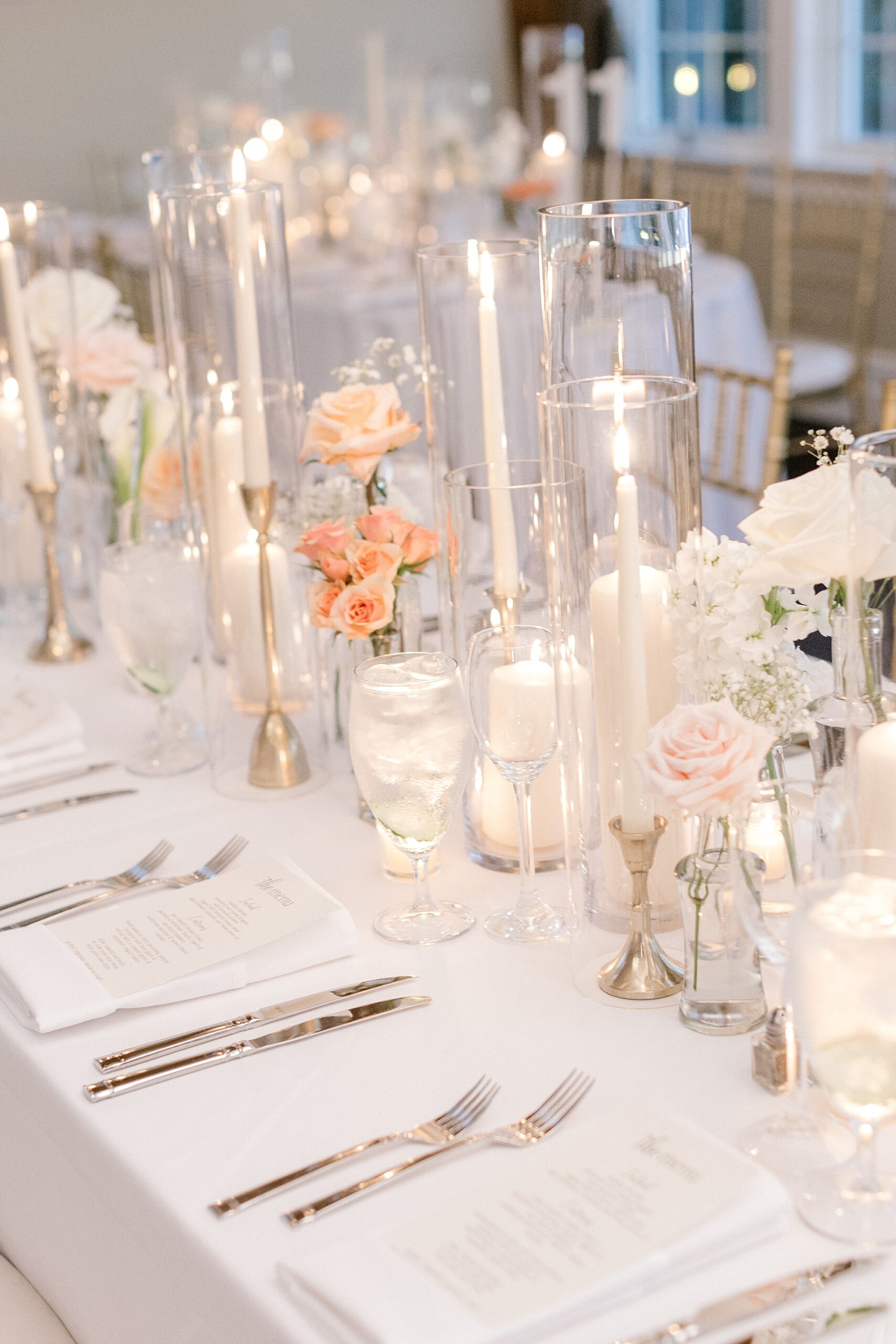 summer wedding reception at Bonnet Island Estate with peach flowers and white candles