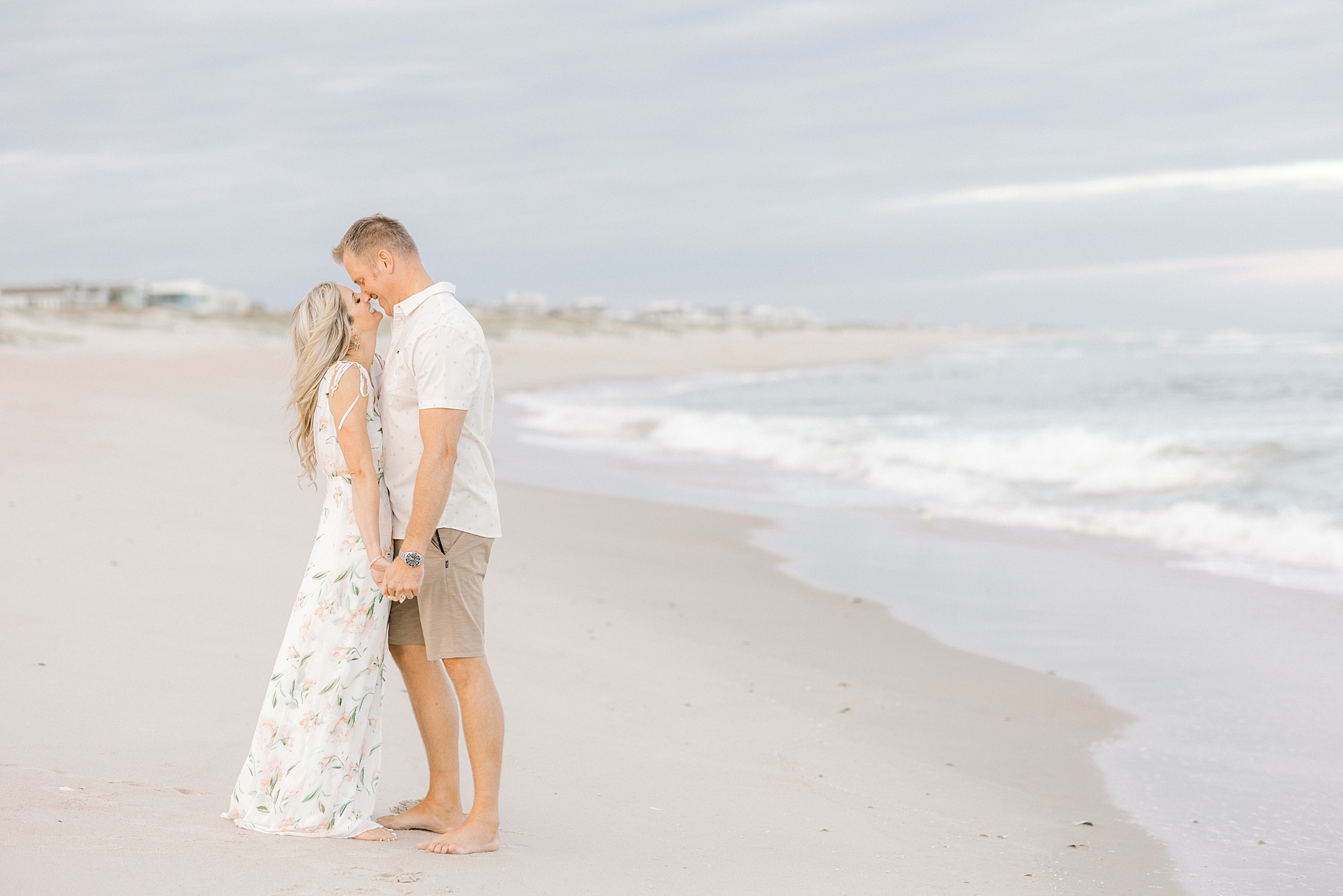 man and woman kiss on Brant Beach during Long Beach Island engagement session