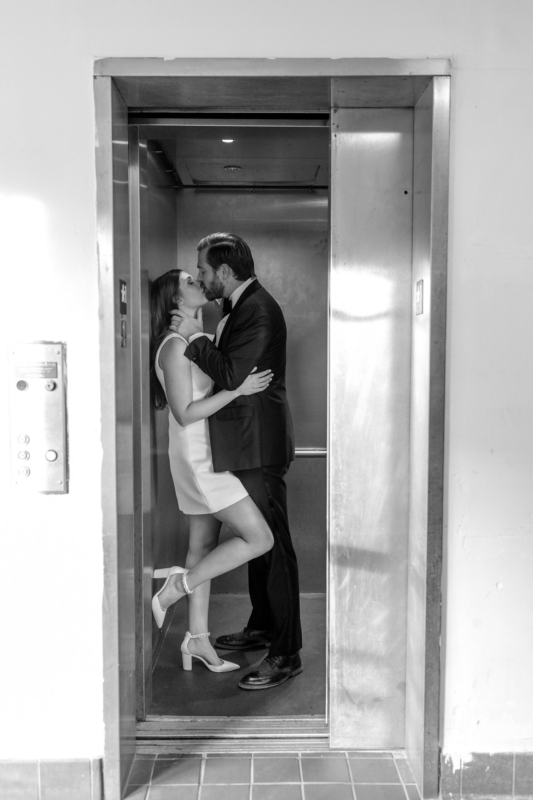 couple kisses inside elevator of Asbury Park restaurant