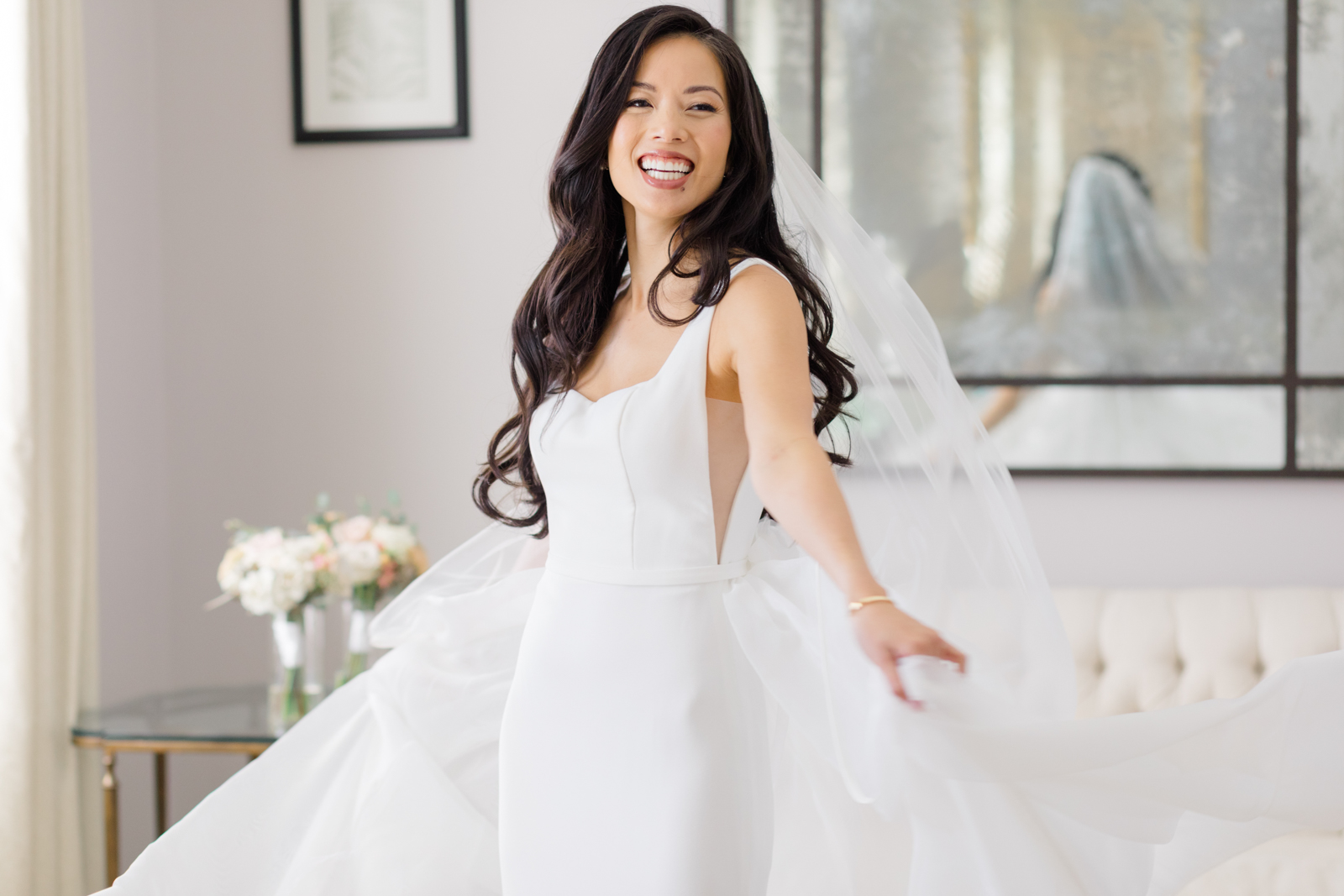 Bride smiles and spins in Lakewood Ranch Golf & Country Club bridal sutie