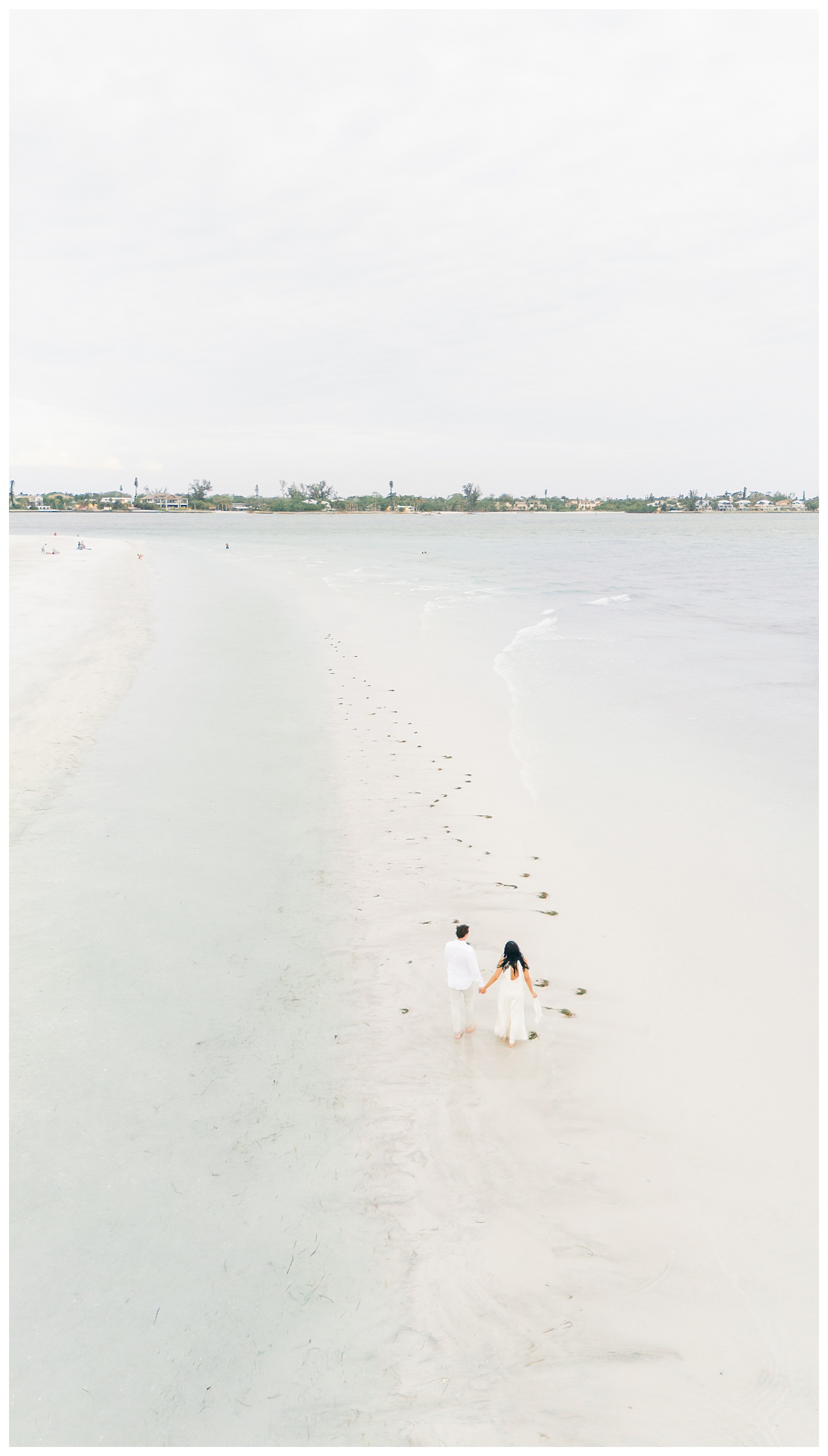 drone shot of a couple on a sandbar on Lido Key in Sarasota Florida