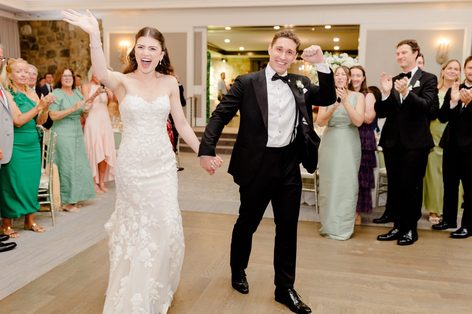 Abby and Will's grand entrance into the reception as guests cheer at Fiddler's Elbow